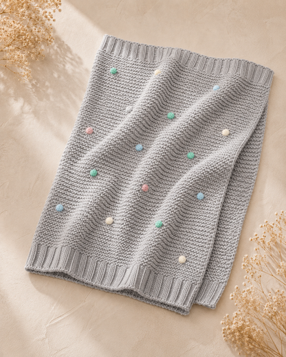 Manta malha pompons bebé Zupi - detalhe